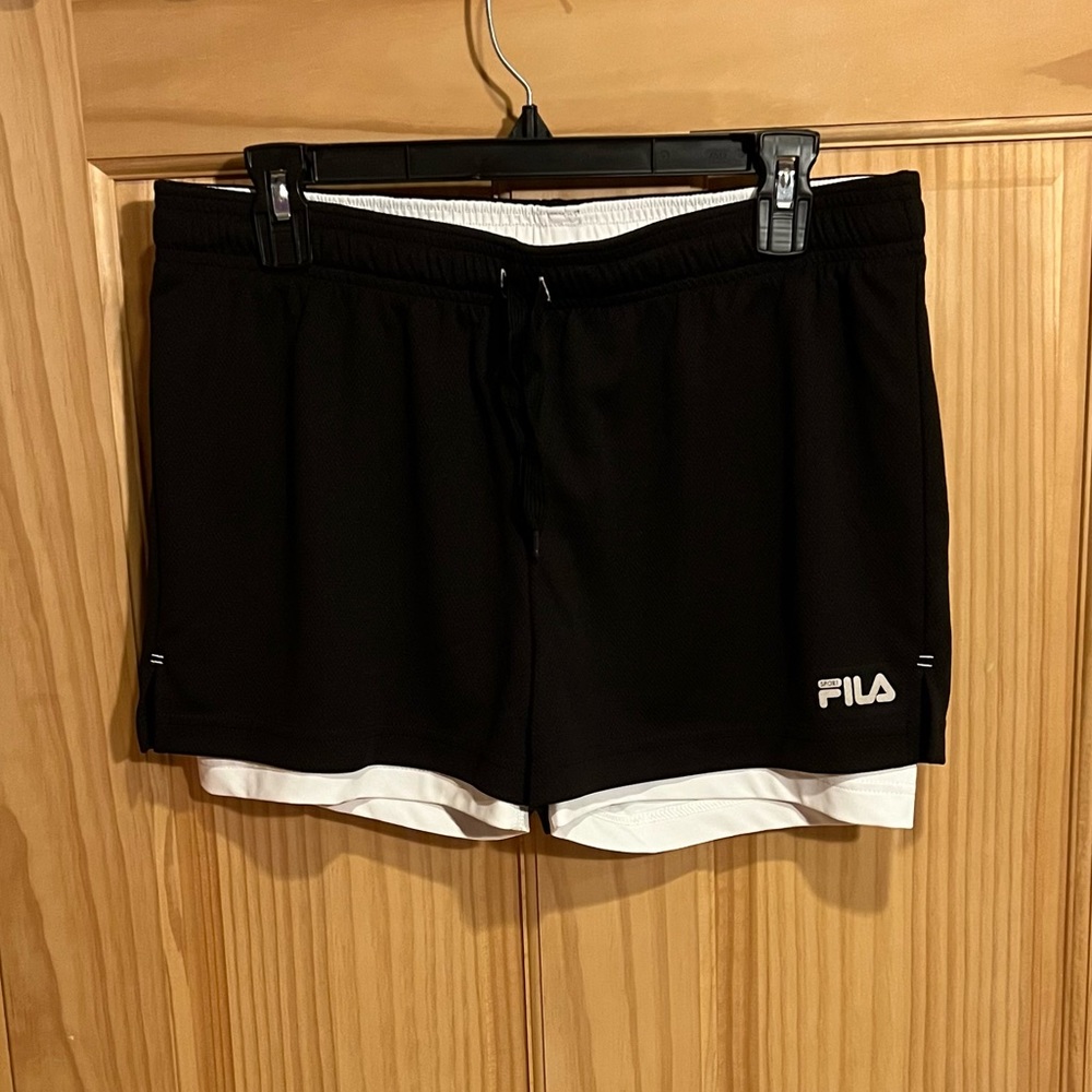 Women’s medium Fila shorts. Attached white bike shorts.